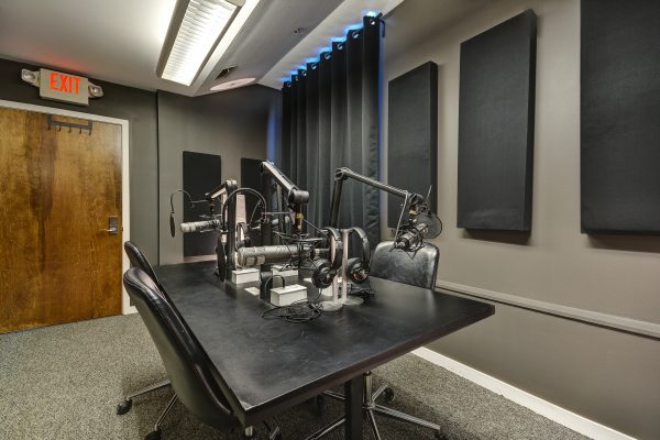 Podcast studio with Microphones, Headphones, and chairs
