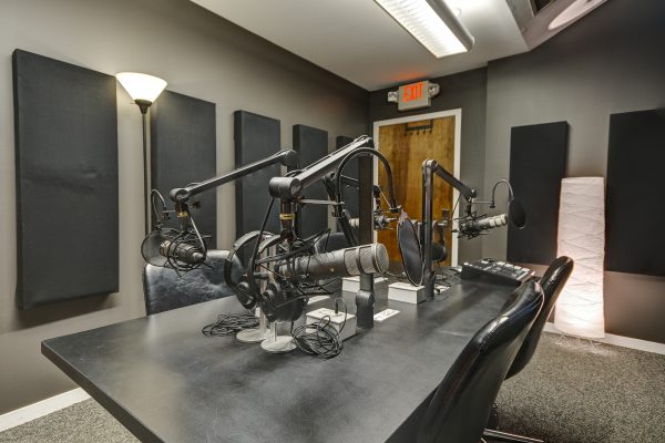 Podcast studio with Microphones, Headphones, and chairs